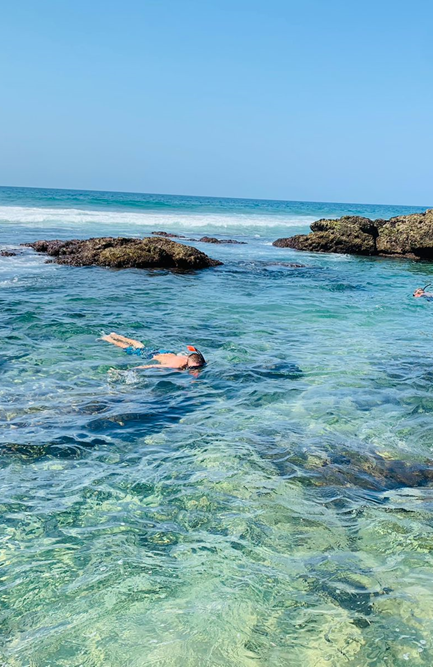 A child snorkelling in a rock pool in Scottburgh, near the Anchored Inn